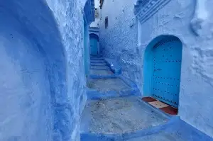 Famous blue-painted alleyway in the heart of Chefchaouen Medina Morocco