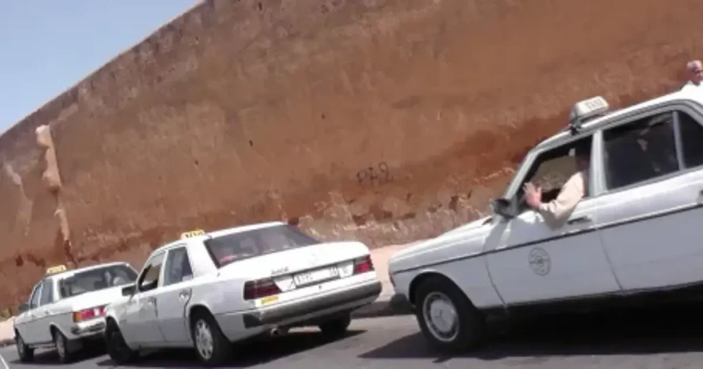 Shared grand taxi Mercedes van parked at Tetouan transport hub ready for Chefchaouen route